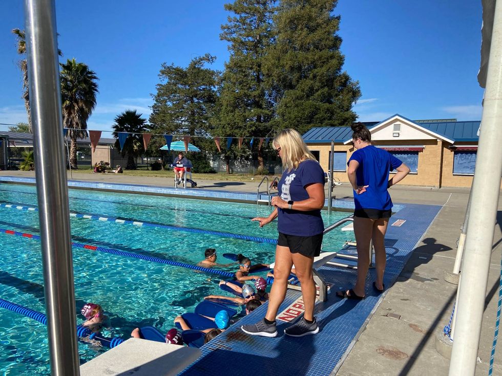 Talli Pitcher has been coaching the Pleasant Hill Dolfins for 20 years and swam for CAL in the late 80s.