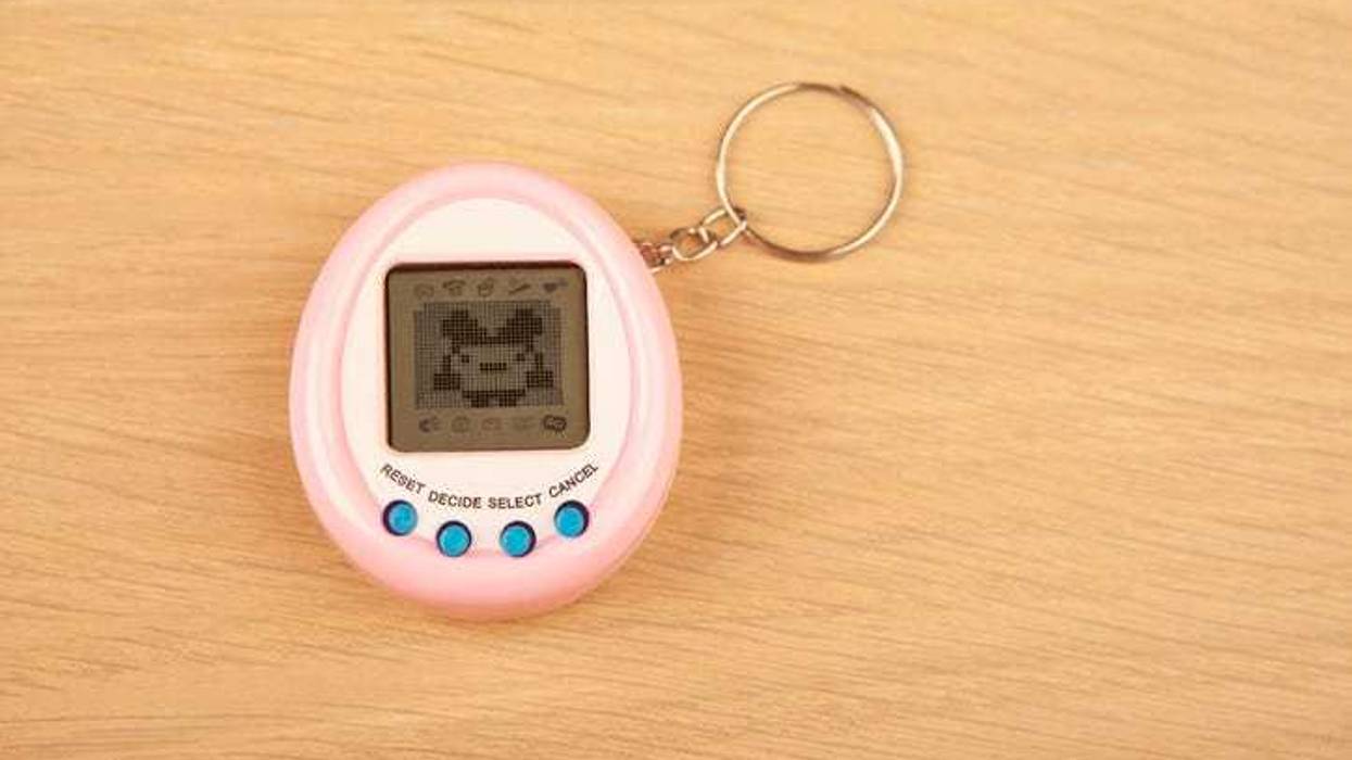 Tamagotchi toy on a desk.