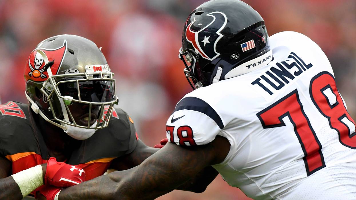 Tampa Bay Buccaneers linebacker Jason Pierre-Paul (90) rushes the passer as Houston Texans offensive tackle Laremy Tunsil (78) defends during the fourth quarter at Raymond James Stadium.