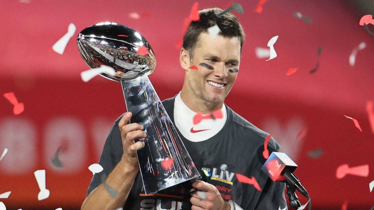 Tampa Bay Buccaneers quarterback Tom Brady (12) hoists the Vince Lombardi Trophy after defeating the Kansas City Chiefs in Super Bowl LV at Raymond James Stadium.