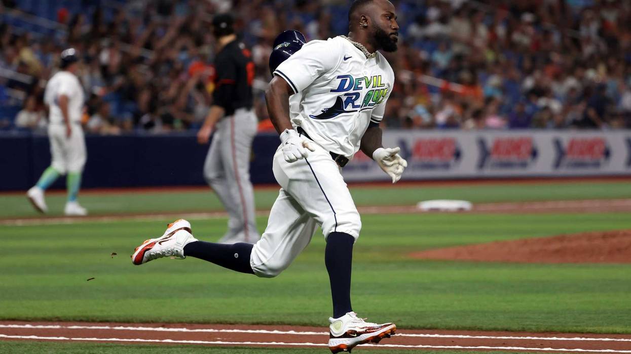 Tampa Bay Rays outfielder Randy Arozarena (56) hits an RBI double against the Baltimore Orioles during the third inning at Tropicana Field.