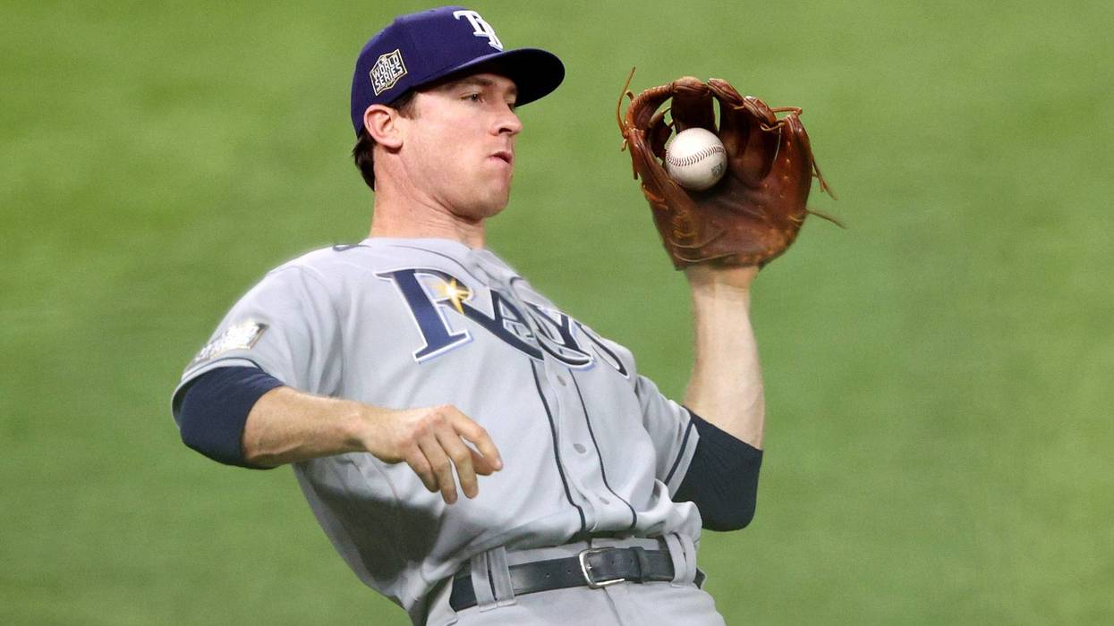Tampa Bay Rays second baseman Joey Wendle catches a fly ball against the Los Angeles Dodgers during the fifth inning in Game Two of the 2020 MLB World Series at Globe Life Field on October 21, 2020 in Arlington, Texas.