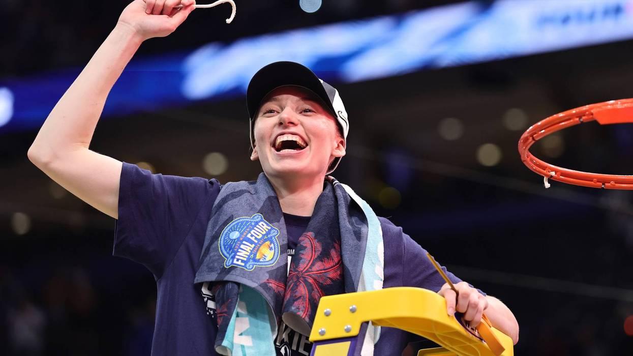 TAMPA, FLORIDA - APRIL 06: Paige Bueckers #5 of the UConn Huskies celebrates with a piece of the net after beating the South Carolina Gamecocks 82-59 to win the National Championship of the NCAA Women's Basketball Tournament at Amalie Arena on April 06, 2025 in Tampa, Florida. (Photo by Carmen Mandato/Getty Images)