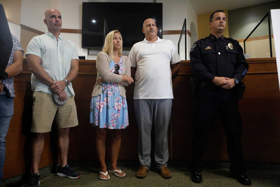 Tara Petito (2L) and Joe Petito look on while the City of North Port Chief of Police Todd Garrison (not seen) speaks during a news conference for their missing daughter Gabby Petito on September 16, 2021 in North Port, Florida