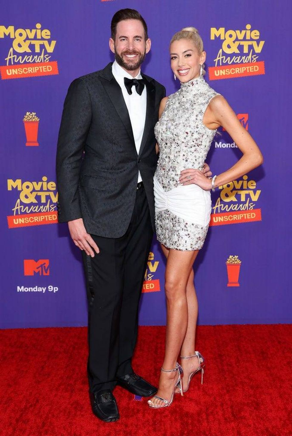 Tarek El Moussa and Heather Rae Young attend the 2021 MTV Movie & TV Awards