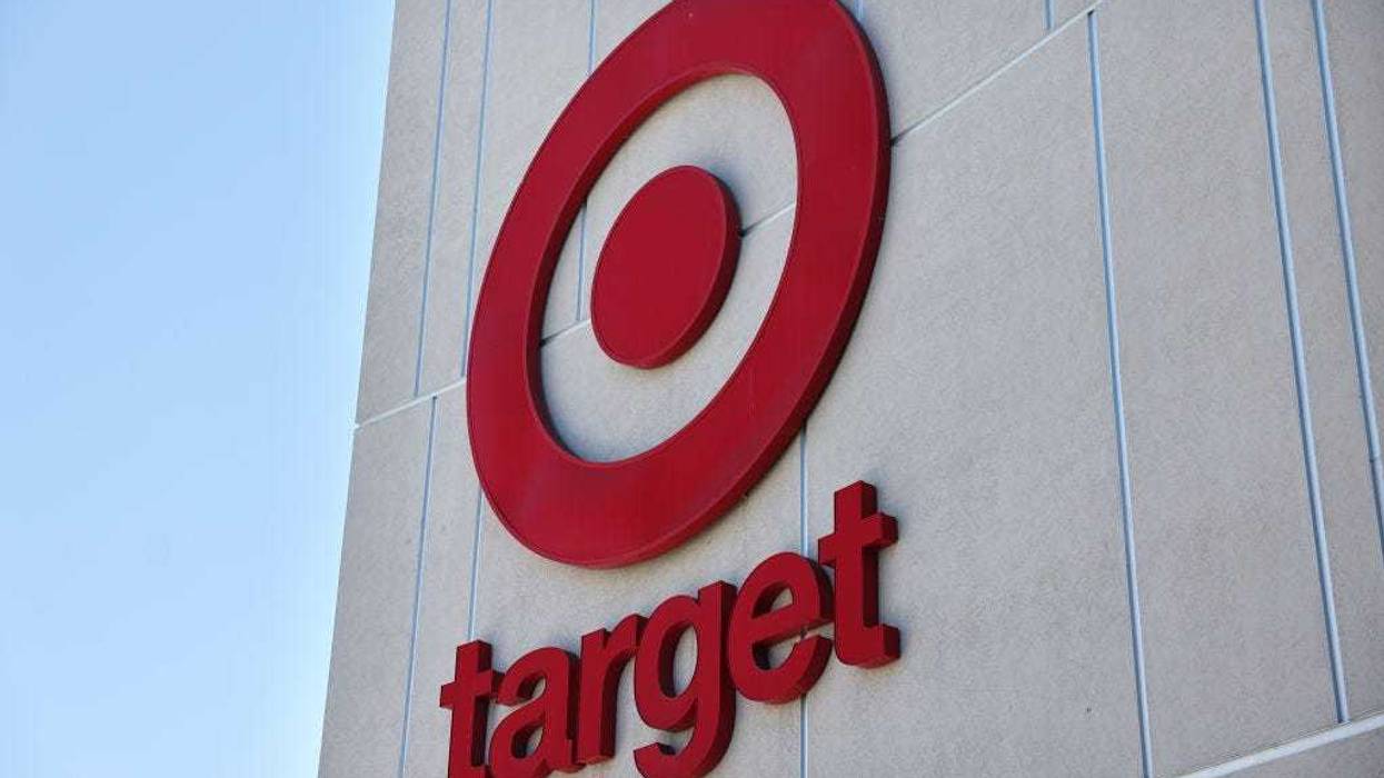 Target etched out a slim sales increase in the third quarter and profits slumped as inflation-weary customers pulled back on spending and costs related to a dockworker strike in October dragged on results.