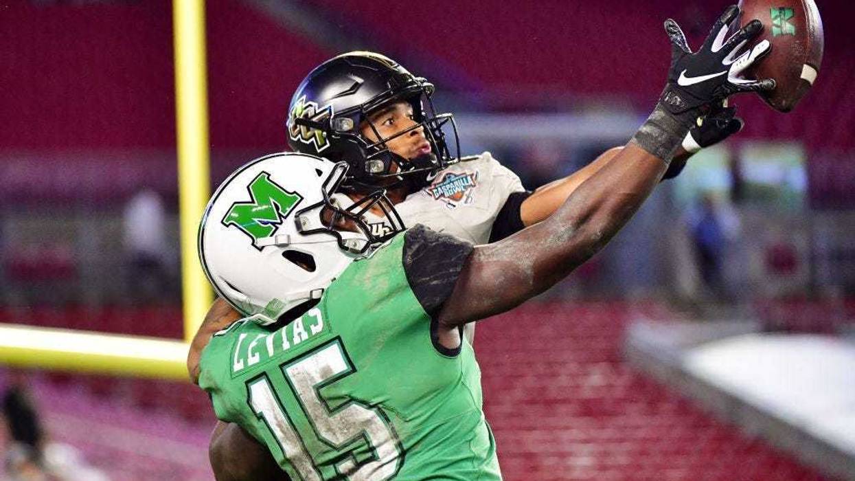 Tay Gowan #23 of the UCF Knights breaks up a pass intended for Armani Levias #15 of the Marshall Thundering Herd during the fourth quarter at the Bad Boy Mowers Gasparilla Bowl at Raymond James Stadium on December 23, 2019 in Tampa, Florida