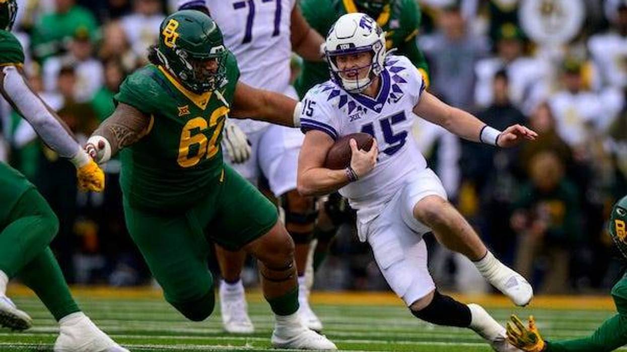 TCU Horned Frogs quarterback Max Duggan (15) is brought down by Baylor Bears defensive lineman Siaki Ika (62) during the second half at McLane Stadium