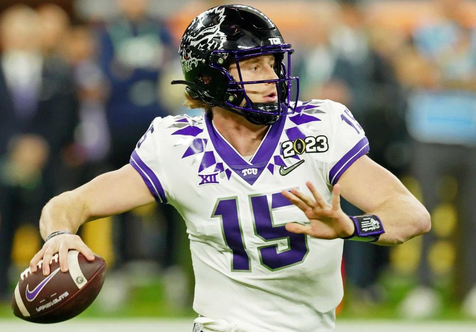 TCU Horned Frogs quarterback Max Duggan (15) looks to pass the ball against the Georgia Bulldogs during the first quarter of the CFP national championship game at SoFi Stadium.