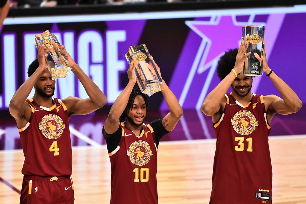 Team Cavs players Jarrett Allen (31), Evan Mobley (4) and Darius Garland (10) celebrate after winning the Taco Bell Skills Challenge during the 2022 NBA All-Star Saturday Night at Rocket Mortgage Field House.