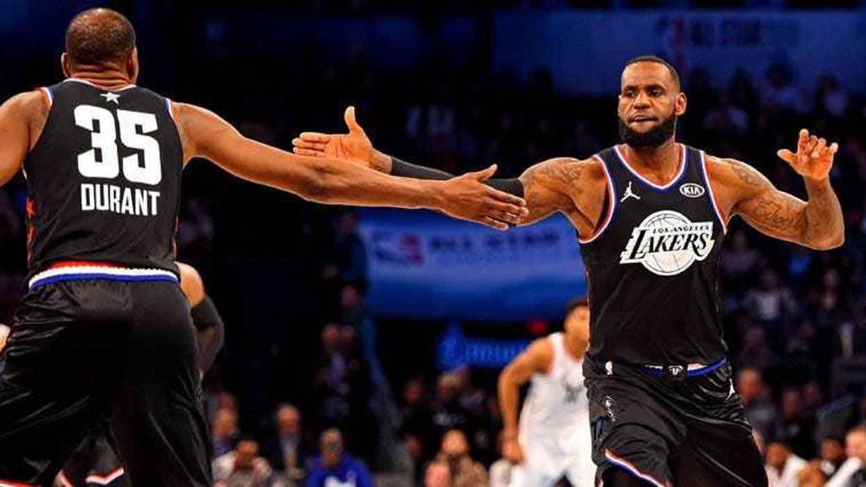 Team LeBron forward LeBron James reacts with teammate Kevin Durant (35) during the NBA All-Star Game at the Spectrum Center in Charlotte, North Carolina.
