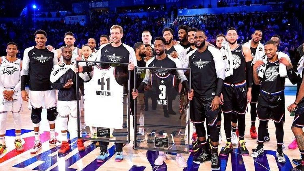 Team Lebron guard Dwayne Wade of the Miami Heat (3) and Team Giannis forward Dirk Nowitzki of the Dallas Mavericks (41) are honored during the 2019 NBA All-Star Game at Spectrum Center.