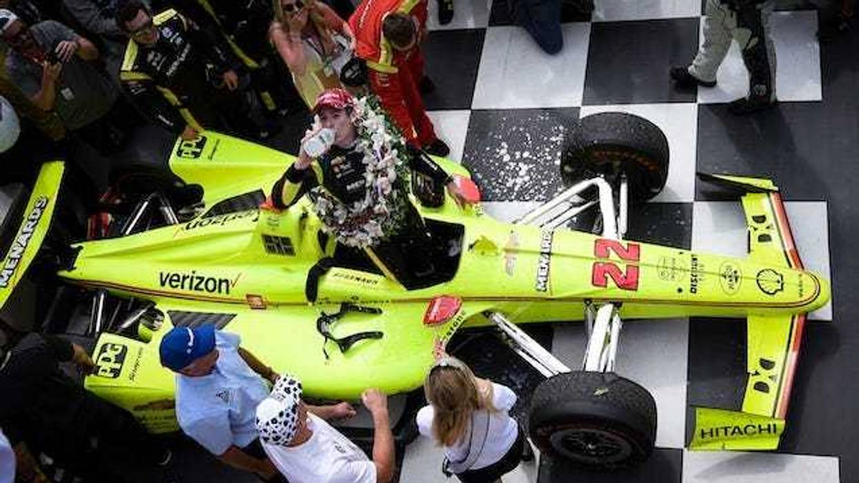 Team Penske's Simon Pagenaud Drinks The Milk In Victory Lane After Winning The 103rd Indianapolis 500