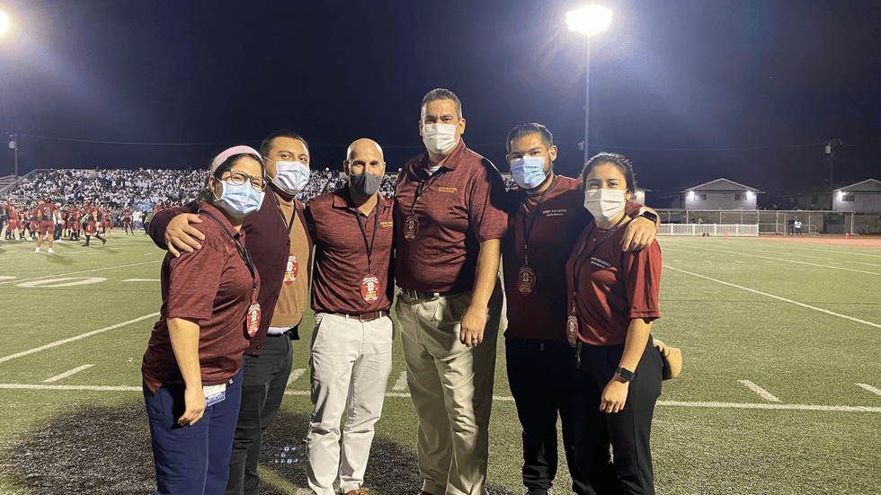 Team Physician - Rivalry Football Game between Downey High School vs Warren High School - Downey, CA (Oct 2021). Pictured from Left to Right: Ana Maria Mejia Cardenia, MD, Erick Leyva, Gustavo Casillas, MD, Daniel Diaz, DO, Alexander Soto, MD, Myra Gutierrez, DO.