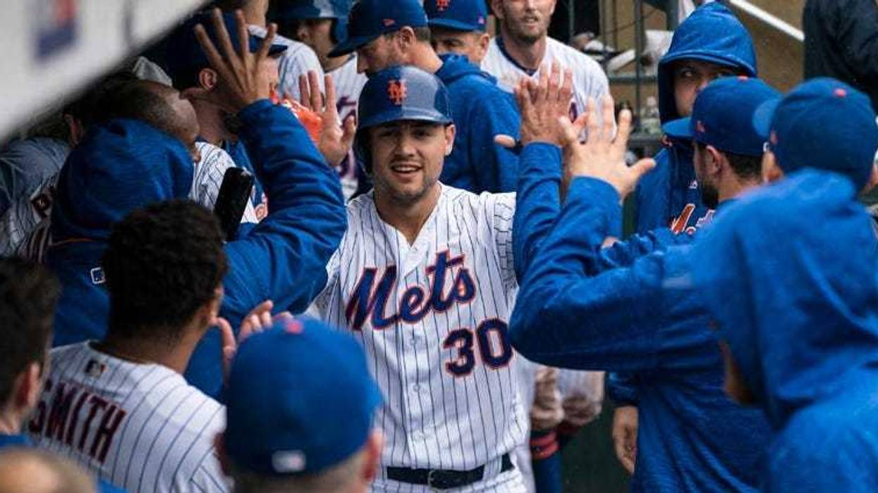 Teammates congratulate Mets outfielder Michael Conforto after he hit a three-run homer against the Philadelphia Phillies on Sept. 9, 2018, at Citi Field.