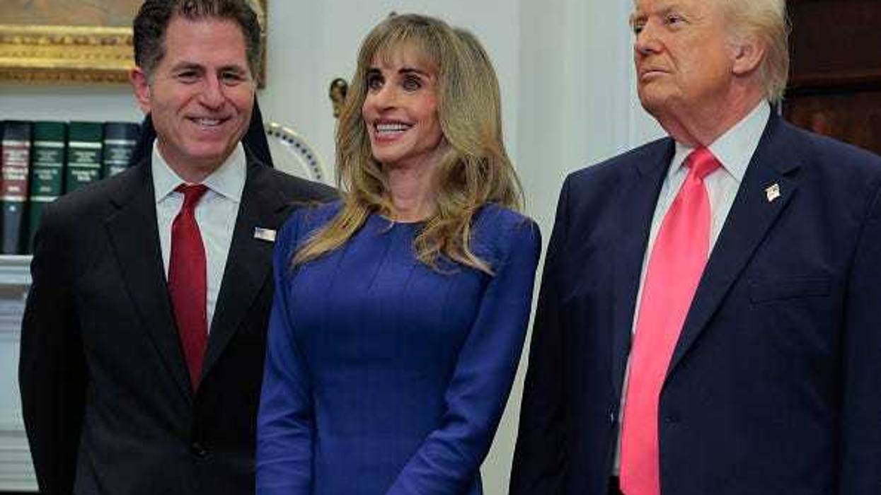 Tech billionaires Michael Dell (L) and Susan Dell join U.S. President Donald Trump to make an announcement about "Trump accounts" in the Roosevelt Room at the White House on December 02, 2025 in Washington, DC. The Dells are contributing $6.25 billion of their own money to the program, which aims to have the government provide $1,000 in seed money for investment accounts that will be granted to children born in the next four years.