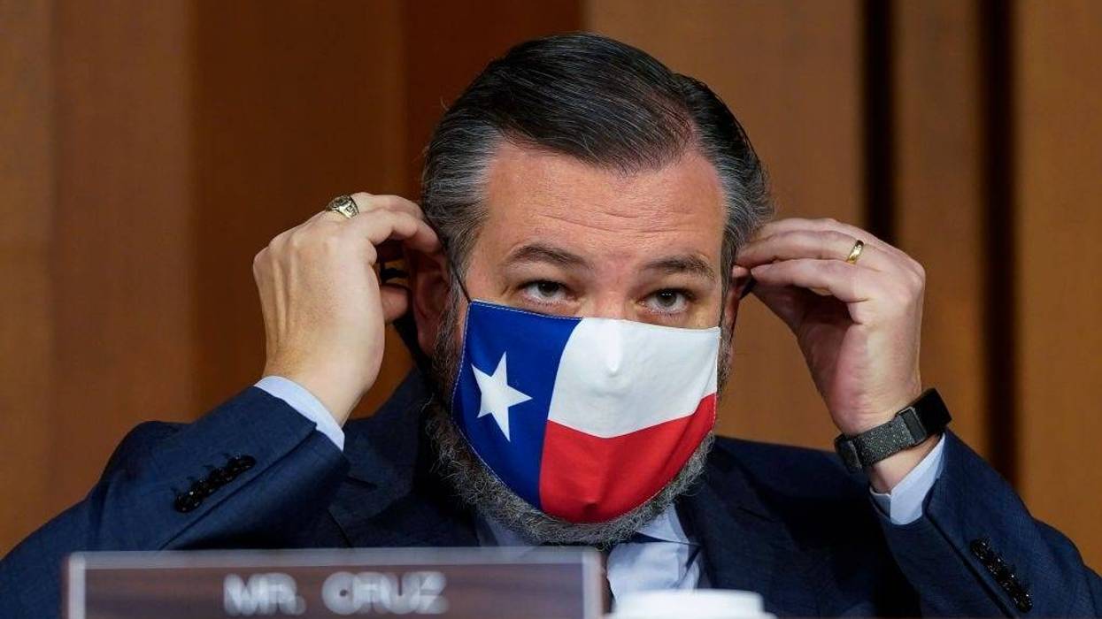 . Ted Cruz (R-TX) adjusts his face covering as Attorney General nominee Merrick Garland testifies during his confirmation hearing before the Senate Judiciary Committee in the Hart Senate Office Building on February 22, 2021 in Washington, DC. Garland previously served at the Chief Judge for the U.S. Court of Appeals for the District of Columbia Circuit.