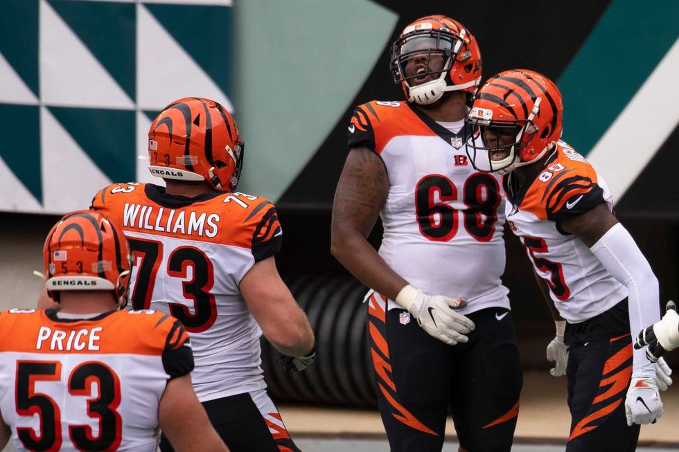 Tee Higgins, far right, celebrates his touchdown against the Eagles.