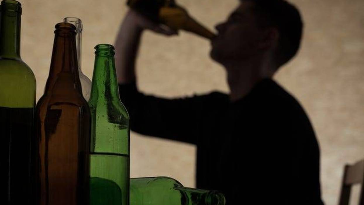 Teen male drinking alcohol.