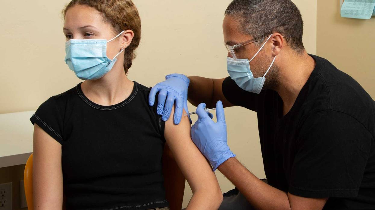 Teen receiving a vaccine