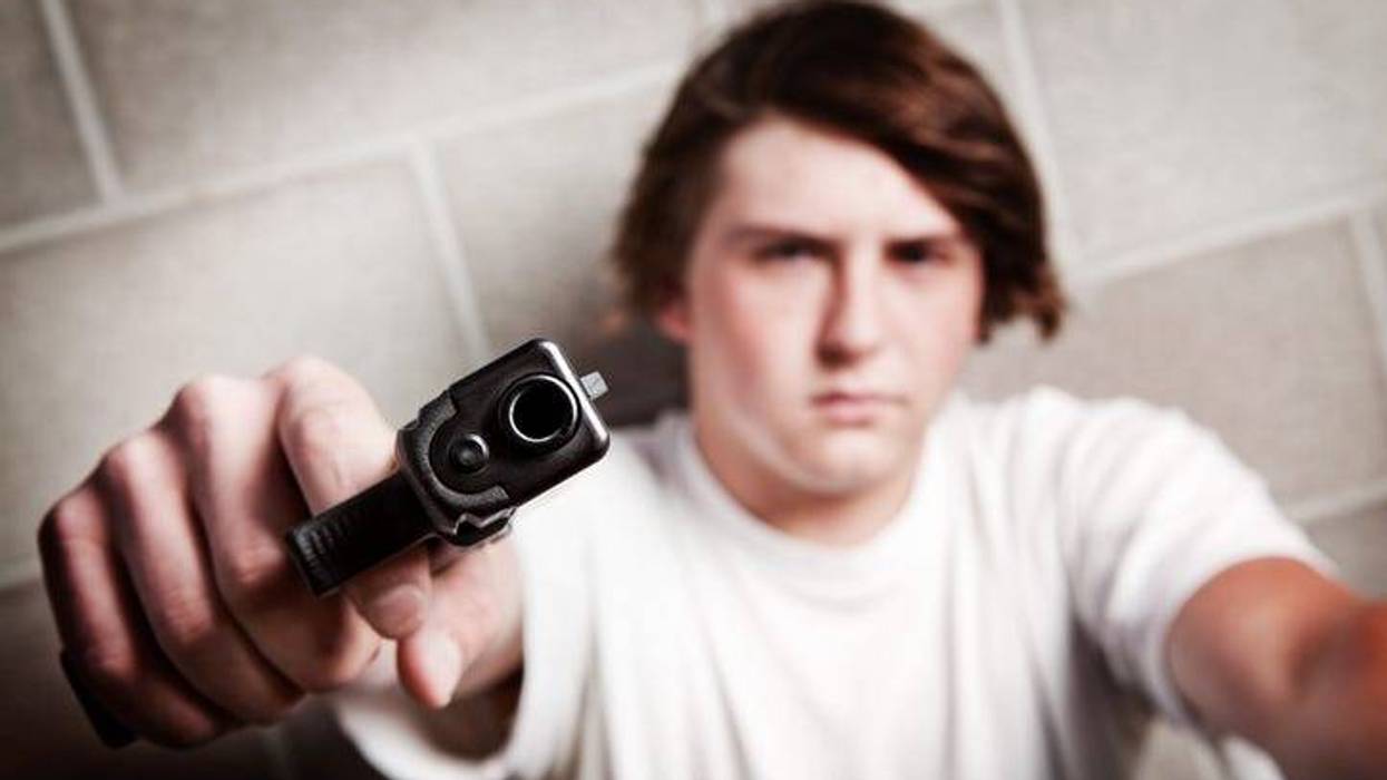 teenager male angry - pointing gun at camera