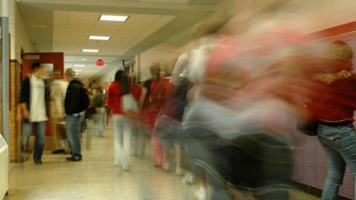 teens in a high school hallway