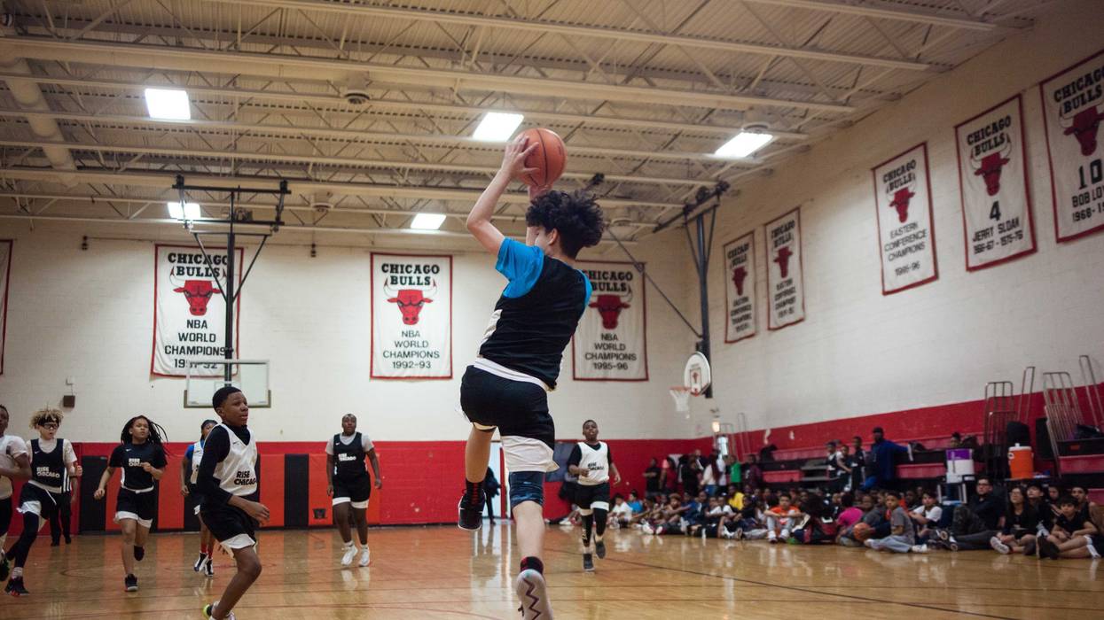 teens playing basketball