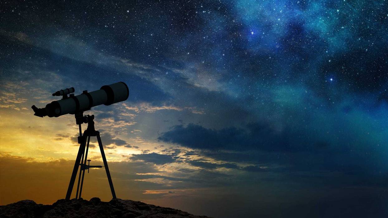 Telescope night sky stock photo.