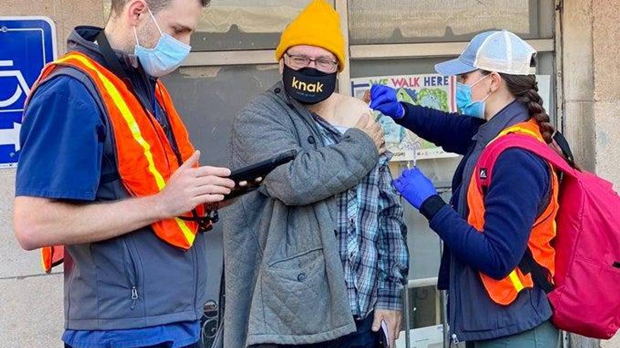 Tenderloin resident receive the COVID-19 vaccine at a mobile clinic on Thanksgiving Day.
