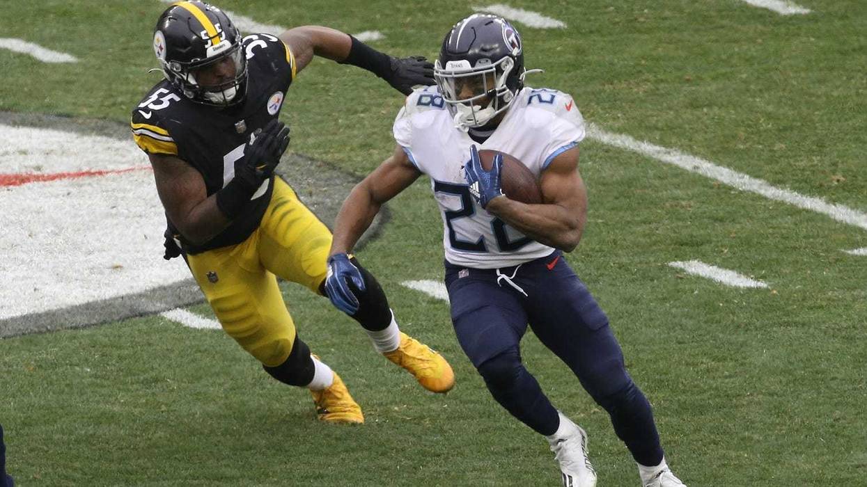 Tennessee Titans running back Jeremy McNichols (28) runs the ball against Pittsburgh Steelers inside linebacker Devin Bush (55