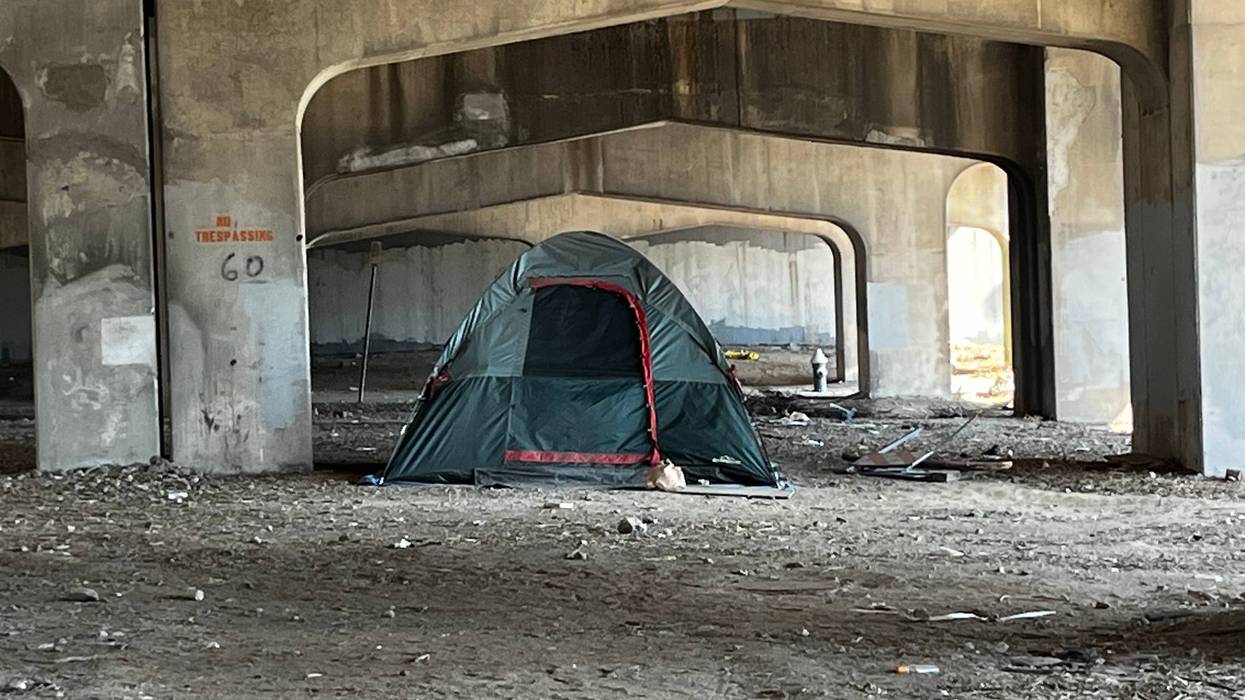 tent set up under highway overpass