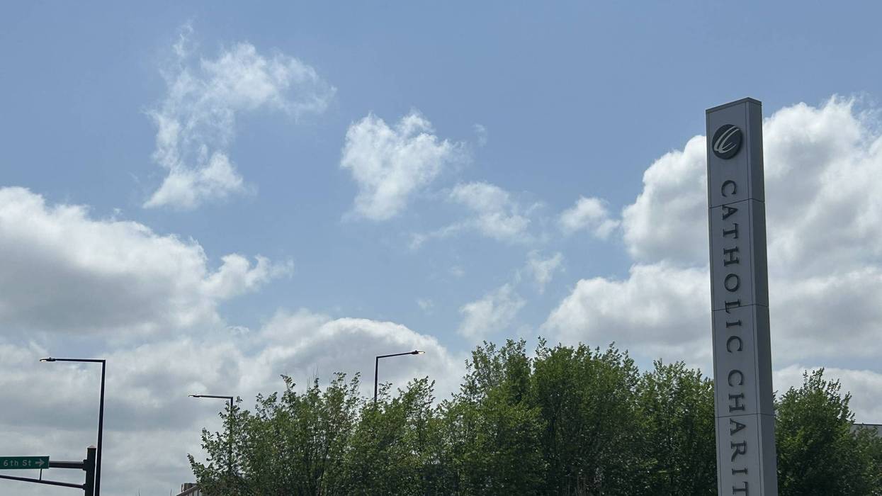 Tents popped up outside the Dorothy Day facility, where Catholic Charities of the Twin Cities is offering voluntary services without requiring formal identification, setting it apart from some other standard shelters in the area.