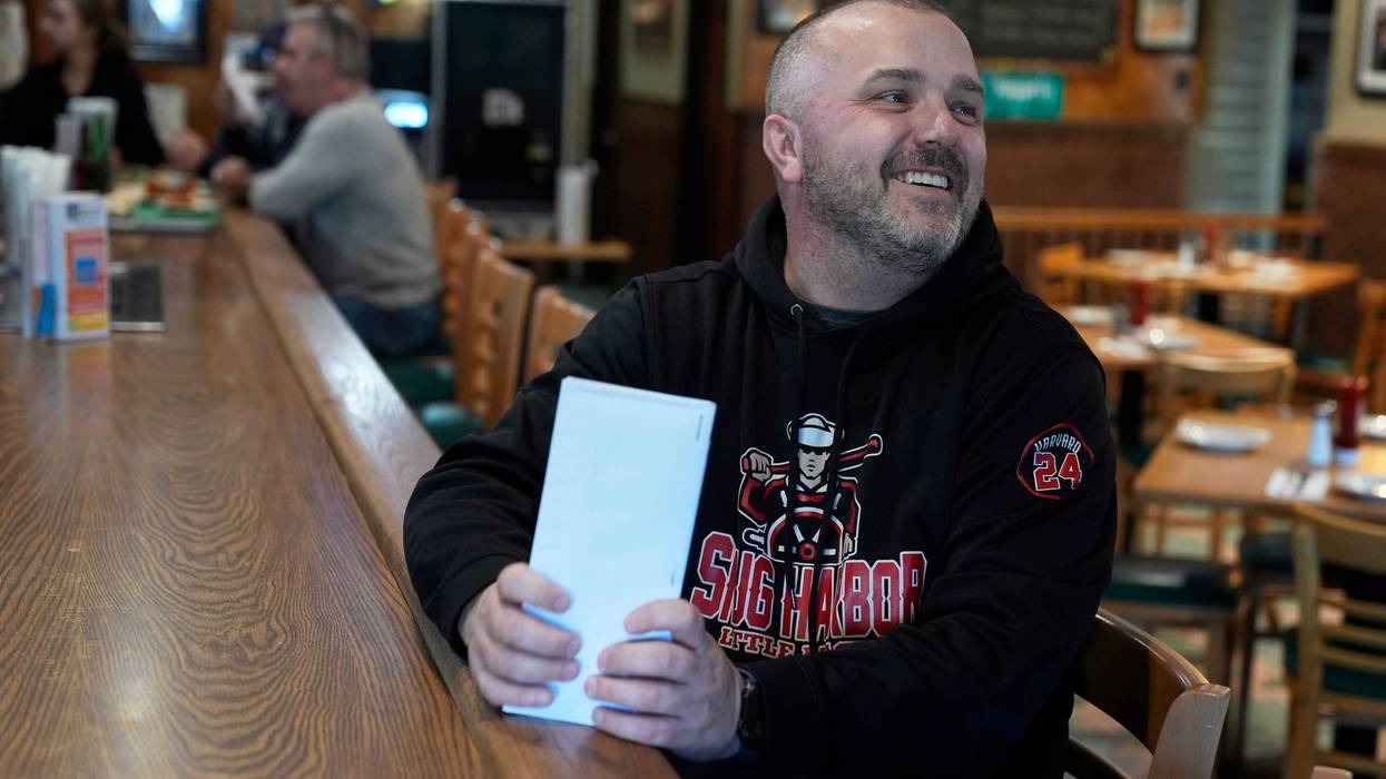 Terence Haggerty talks to customers in his family bar, Jody's Club Forest, in Staten Island, New York, March 10, 2025.