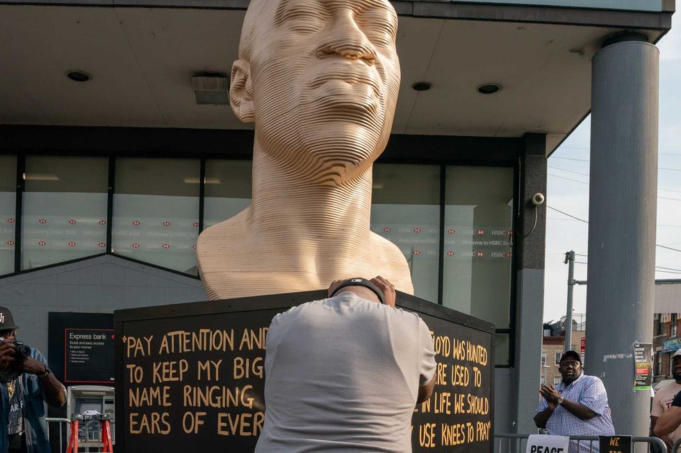 Terrance Floyd weeps during the unveiling of a statute dedicated to his brother George Floyd at Flatbush Junction on June 19, 2021, in the Brooklyn borough of New York City