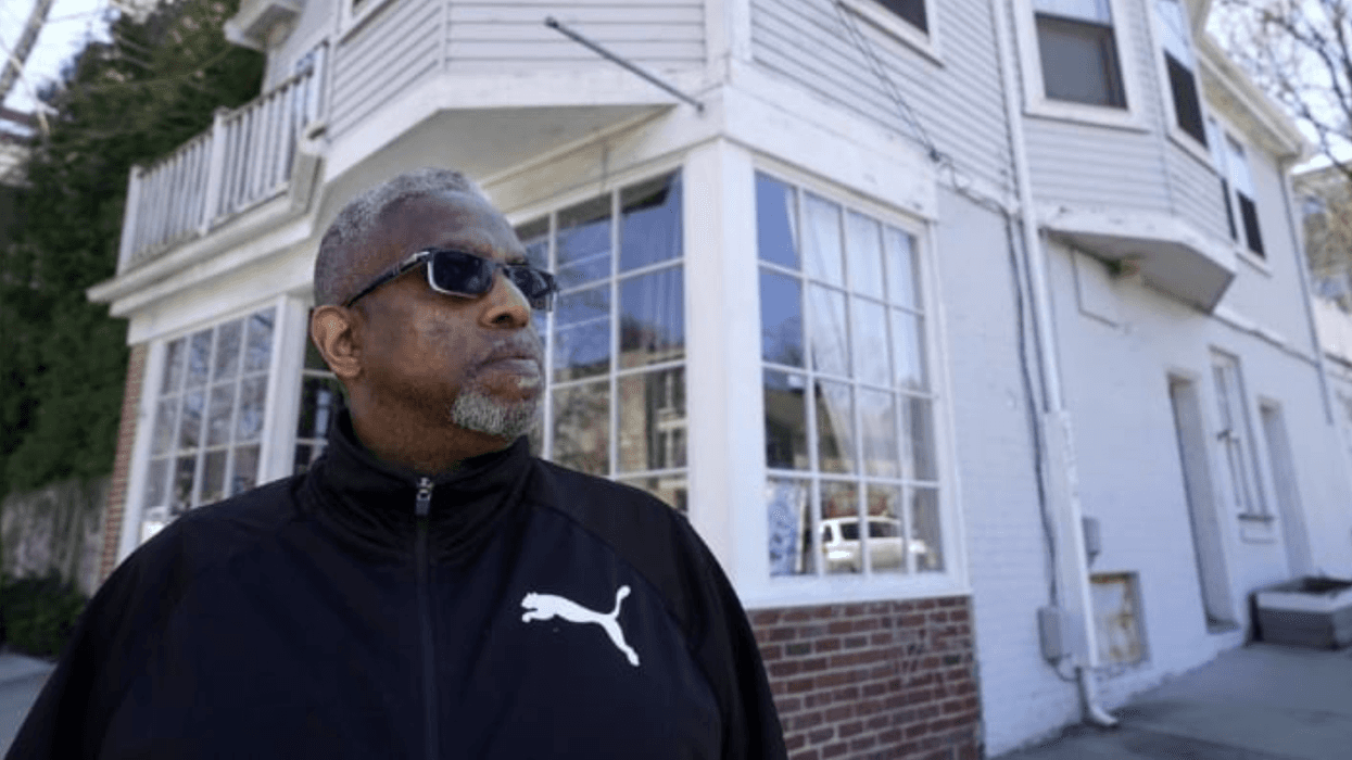 Terrell Osborne stands for a portrait in front of a of Providence, R.I. antique shop that was a general store in the early 1960s in what was then known as the Lippitt Hill neighborhood.