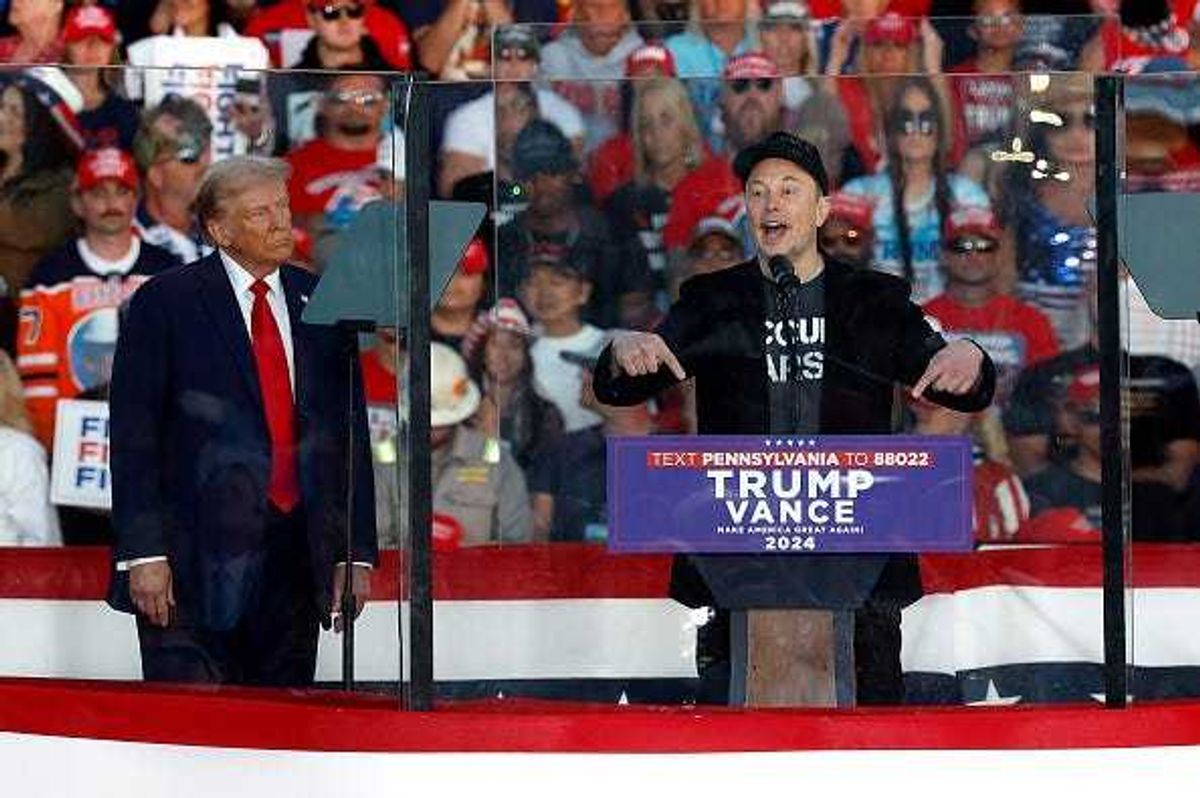 Tesla CEO Elon Musk (R) endorses Republican presidential nominee, former President Donald Trump during a campaign rally at the Butler Farm Show fairgrounds on October 05, 2024 in Butler, Pennsylvania.