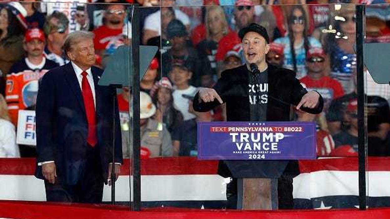 Tesla CEO Elon Musk (R) endorses Republican presidential nominee, former President Donald Trump during a campaign rally at the Butler Farm Show fairgrounds on October 05, 2024 in Butler, Pennsylvania.