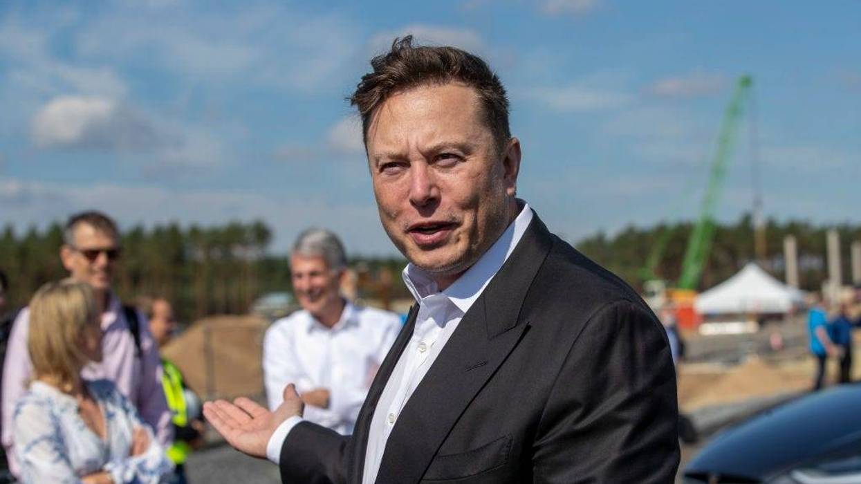 Tesla head Elon Musk talks to the press as he arrives to to have a look at the construction site of the new Tesla Gigafactory near Berlin on September 03, 2020 near Gruenheide, Germany.