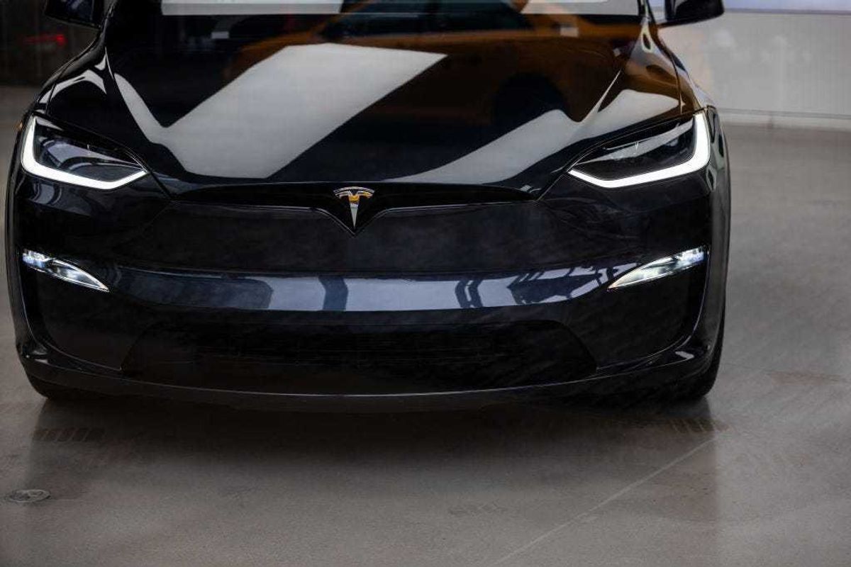 Tesla vehicles are displayed in a Manhattan showroom on January 24, 2024 in New York City. Tesla, the electric car maker, is set to report its fourth-quarter earnings for 2023 after the closing bell Wednesday. Analysts are expecting the company to report earnings of $25.6 billion.
