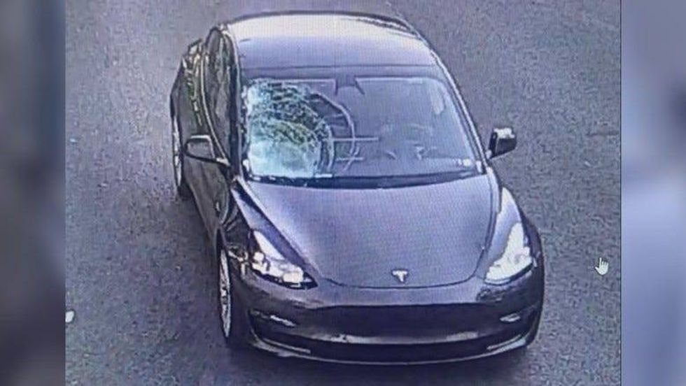 Tesla with window damage