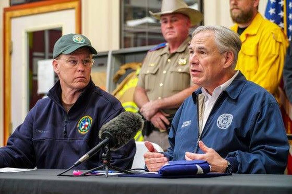 Texas Gov. Governor Abbott and Texas Department of Emergency Management Chief Nim Kidd in Eastland discussing a severe fire.