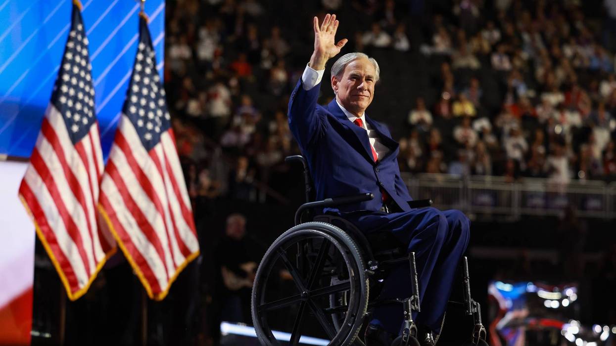 Texas Gov. Greg Abbott waves on stage on the third day of the Republican National Convention at the Fiserv Forum on July 17, 2024, in Milwaukee, Wisconsin.