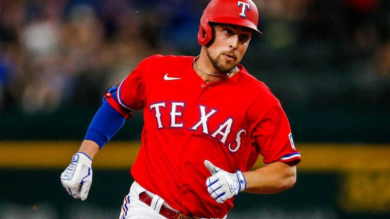 Texas Rangers' Nate Lowe runs to third on a two RBI triple during the fourth inning
