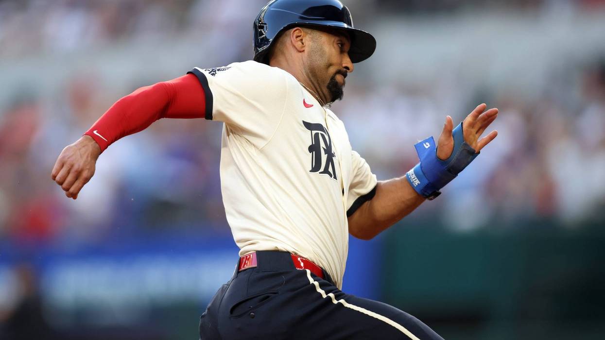Texas Rangers second base Marcus Semien (2) scores a run during the second inning against the St. Louis Cardinals at Globe Life Field.