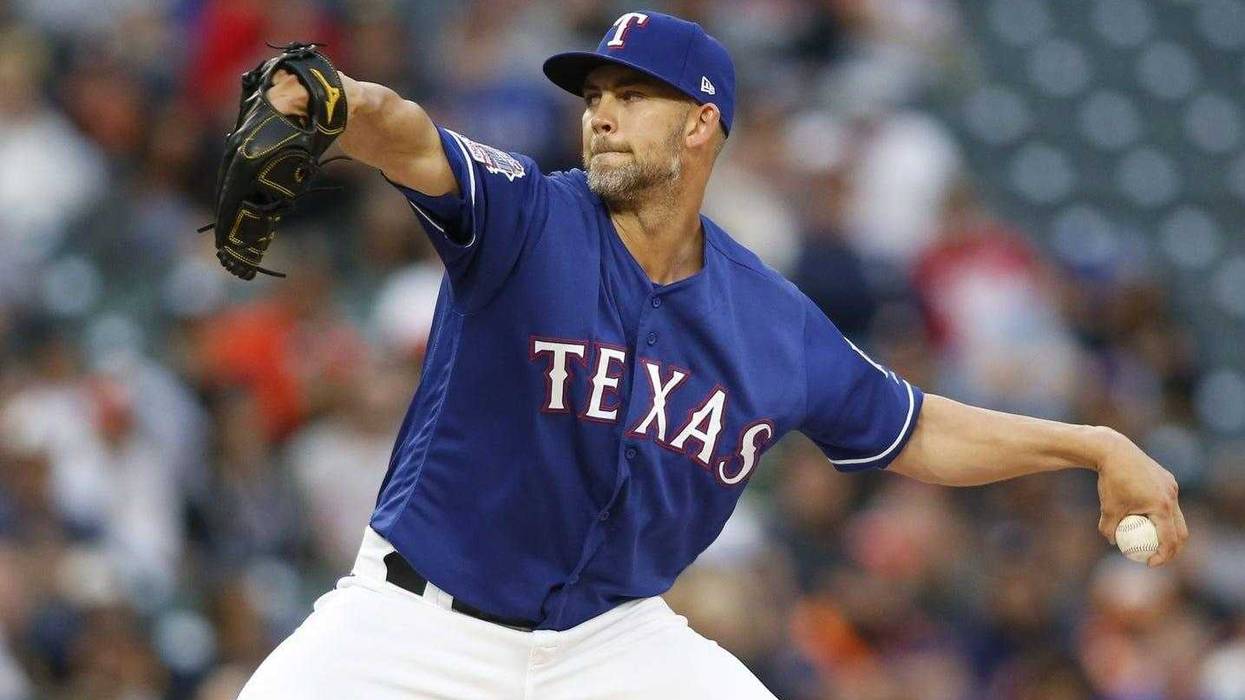 Texas Rangers starting pitcher Mike Minor (23) pitches in the first inning against the Houston Astros at Globe Life Park in Arlington.