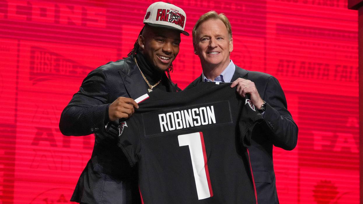 Texas running back Bijan Robinson with NFL commissioner Roger Goodell after being selected by the Atlanta Falcons eighth overall in the first round of the 2023 NFL Draft