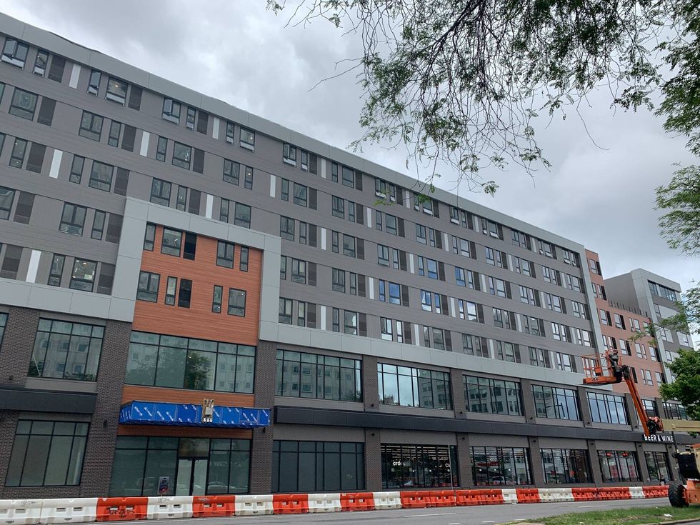 The 18-month development includes four floors of new residential apartments.