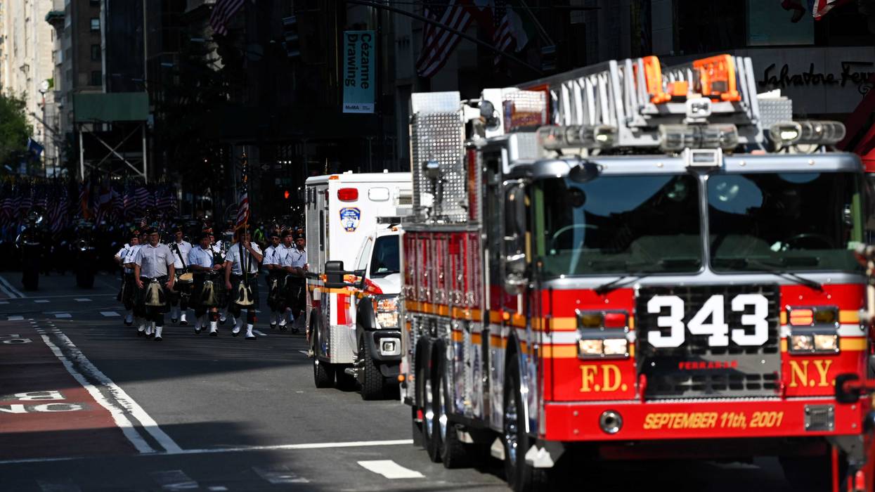 The 343 firetruck along with the FDNY Pipes and Drums and members of the New York City Fire Department participate in the processional as part the FDNY Memorial Service at St. Patrick's Cathedral on September 11, 2021 in New York City.