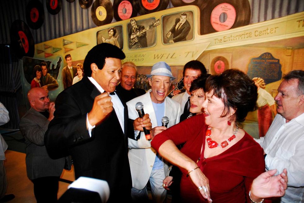 The 50th anniversary celebration of "American Bandstand" in Philadelphia in 2007. Chubby Checker does the twist with Kathleen "Bunny" Gibson, an early dancer on the show, as Jerry Blavat and Connie Francis (both center) watch.