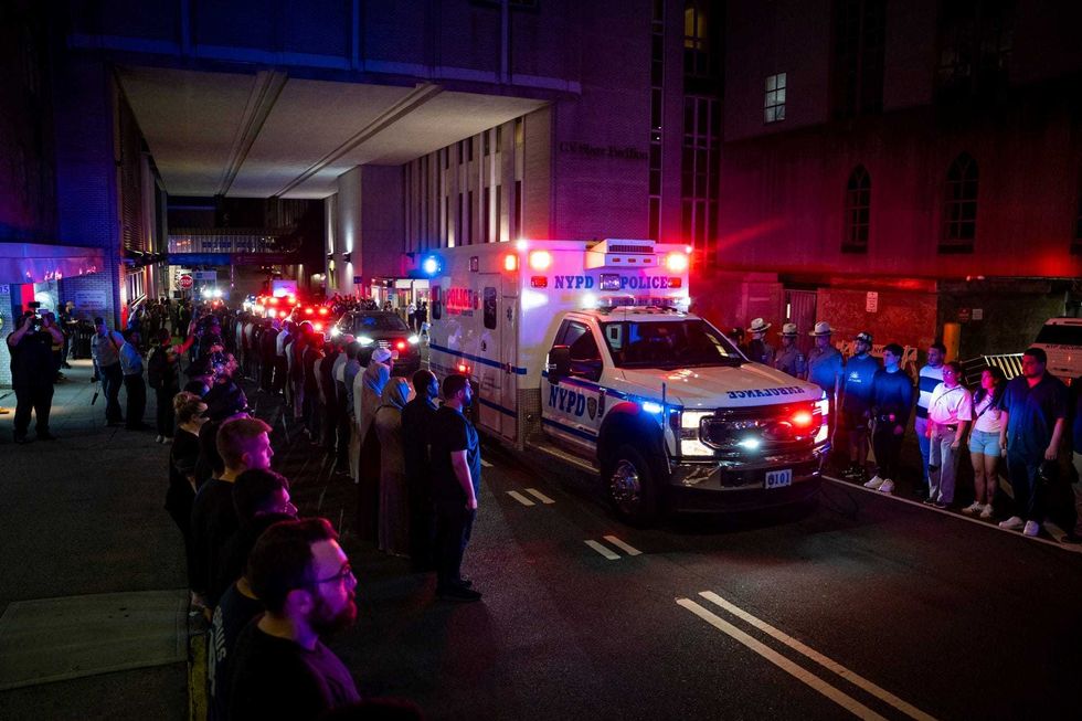 The ambulance carrying the body of Didarul Islam exits NewYork-Presbyterian/Weill Cornell Medical Hospital during the dignified transfer of the slain officer, who was shot and killed by a gunman Monday evening, early Tuesday, July 29, 2025